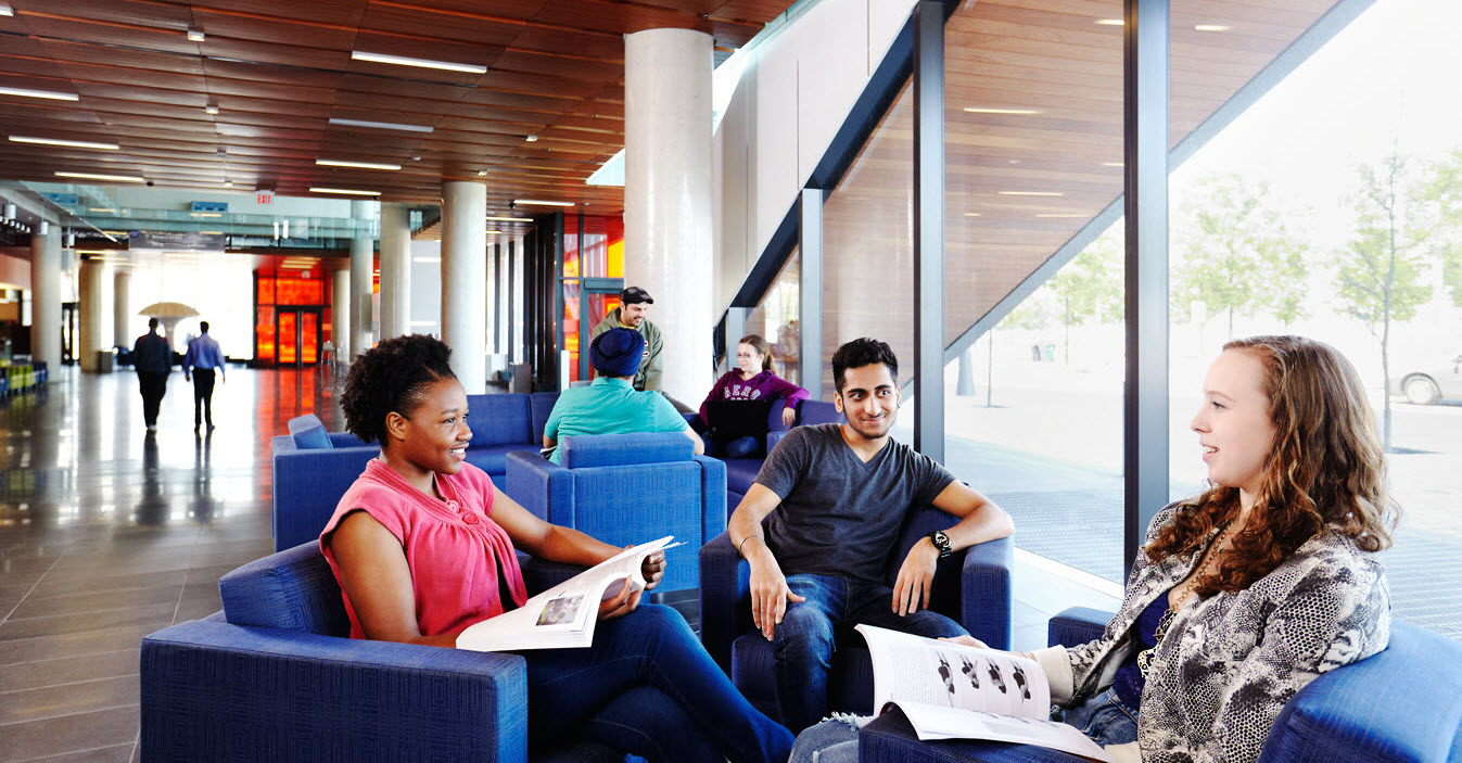 Students study together in a common area of the Waterfront campus.